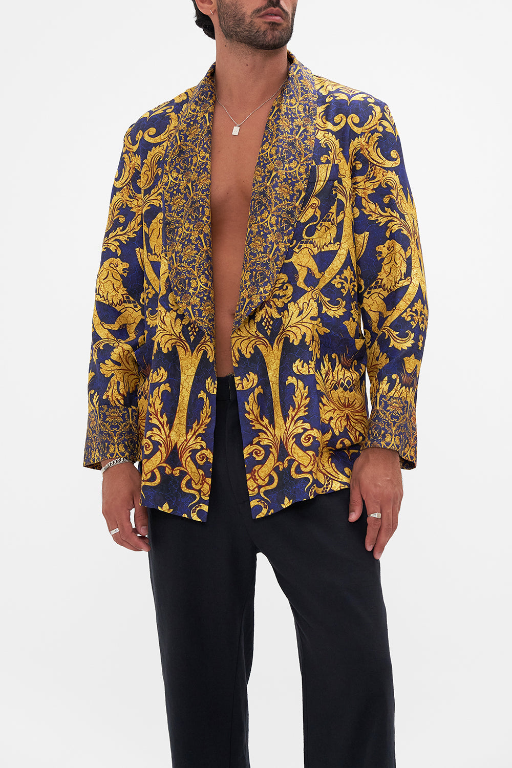 Crop view of model wearing Hotel Franks by CAMILLA mens silk robe in Venice Vignette print