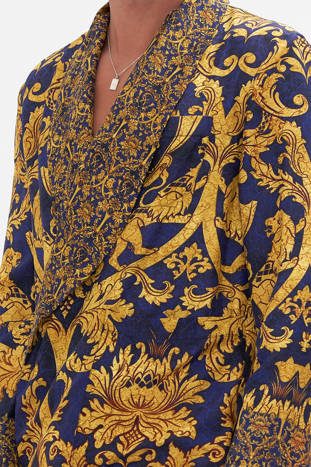 Detail view of model wearing Hotel Franks by CAMILLA mens silk robe in Venice Vignette print
