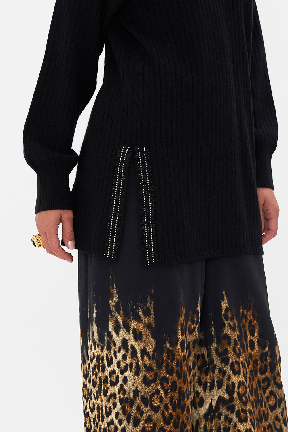 Crop view of model wearing CAMILLA black v neck wool cashmere knit jumper in Lions Mane print