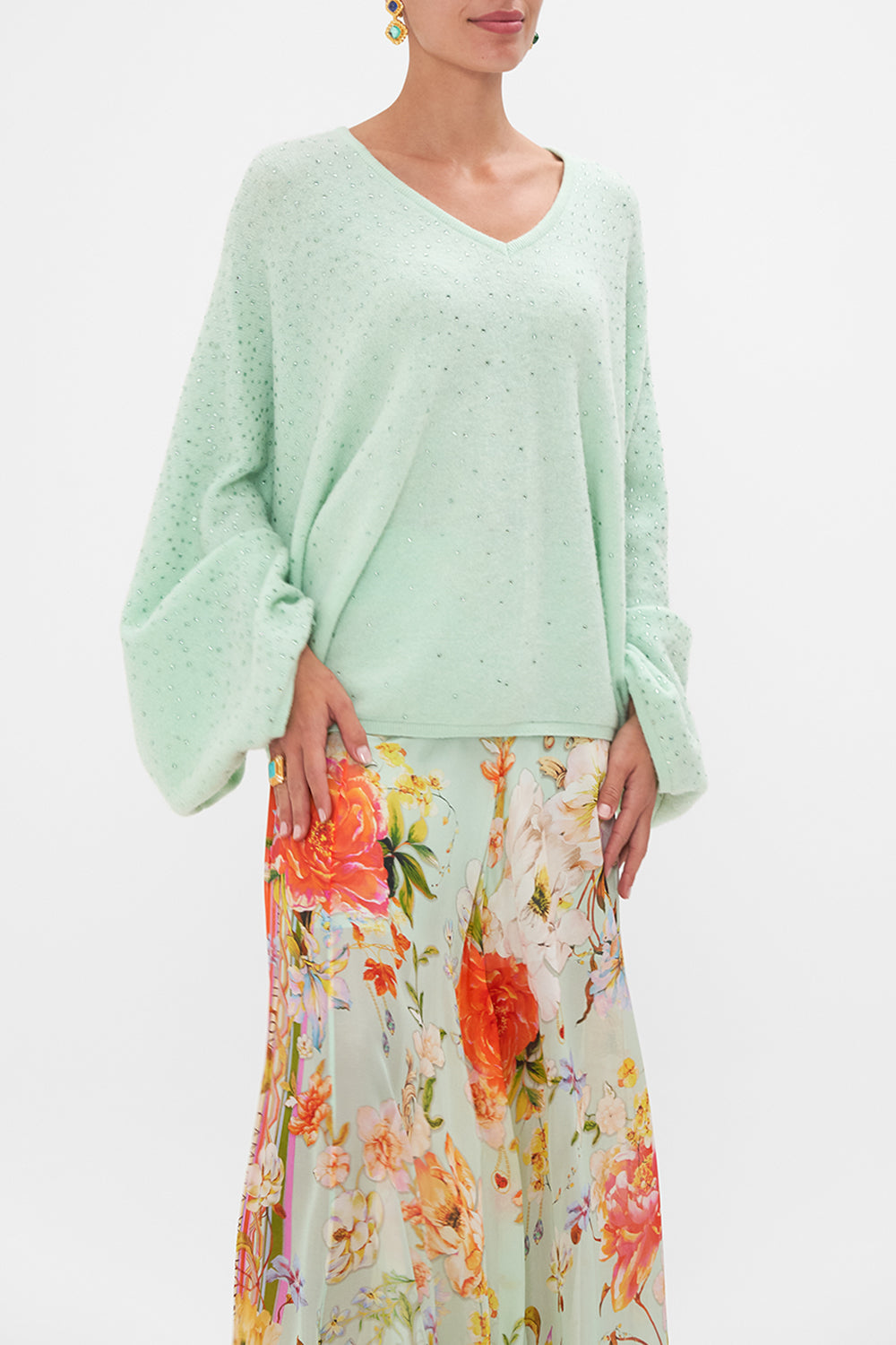 Crop view of model wearing CAMILLA v neck knit jumper in mint