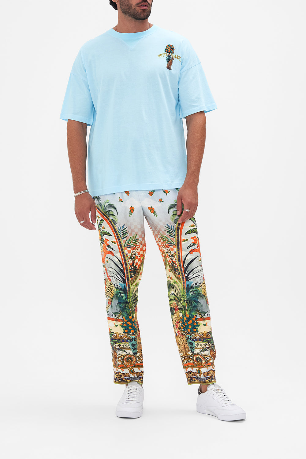Front view of model wearing HOTEL FRANKS BY CAMILLA mens tee in Alessandro's Atlantis printed