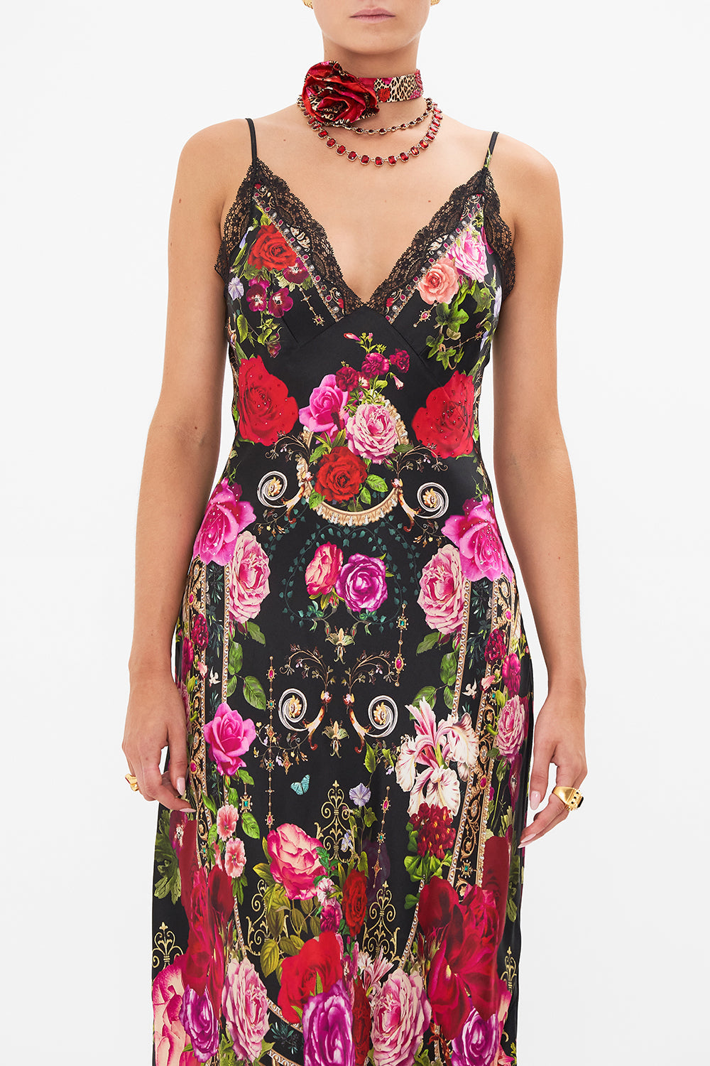 Crop view of model wearing CAMILLA bias silk slip dress in Reservation for Love print