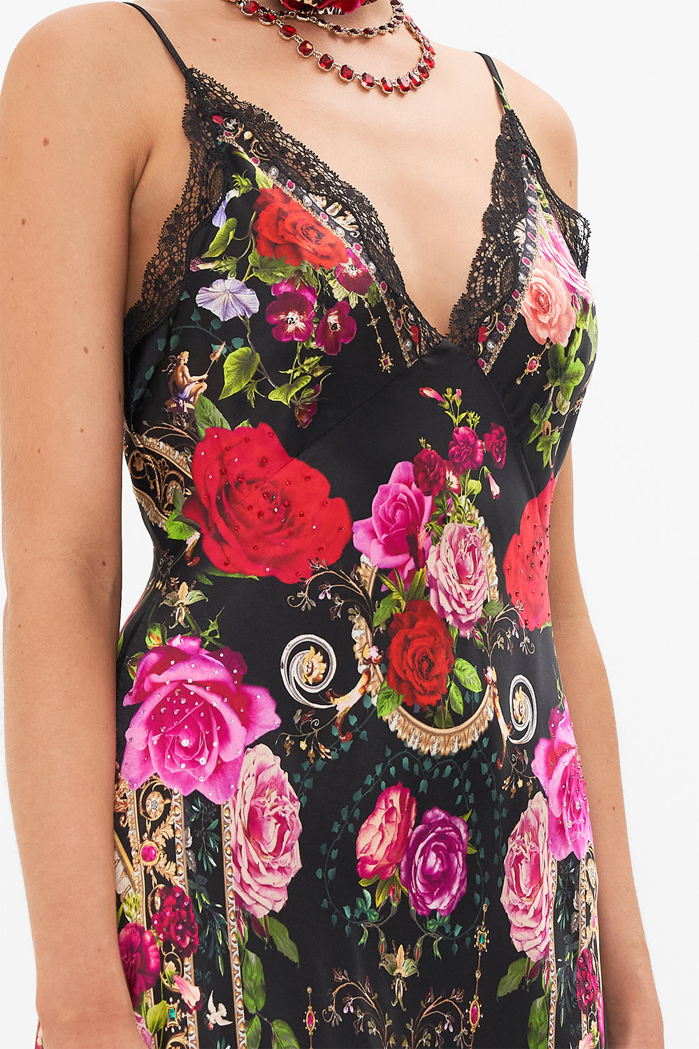 Detail view of model wearing CAMILLA bias silk slip dress in Reservation for Love print