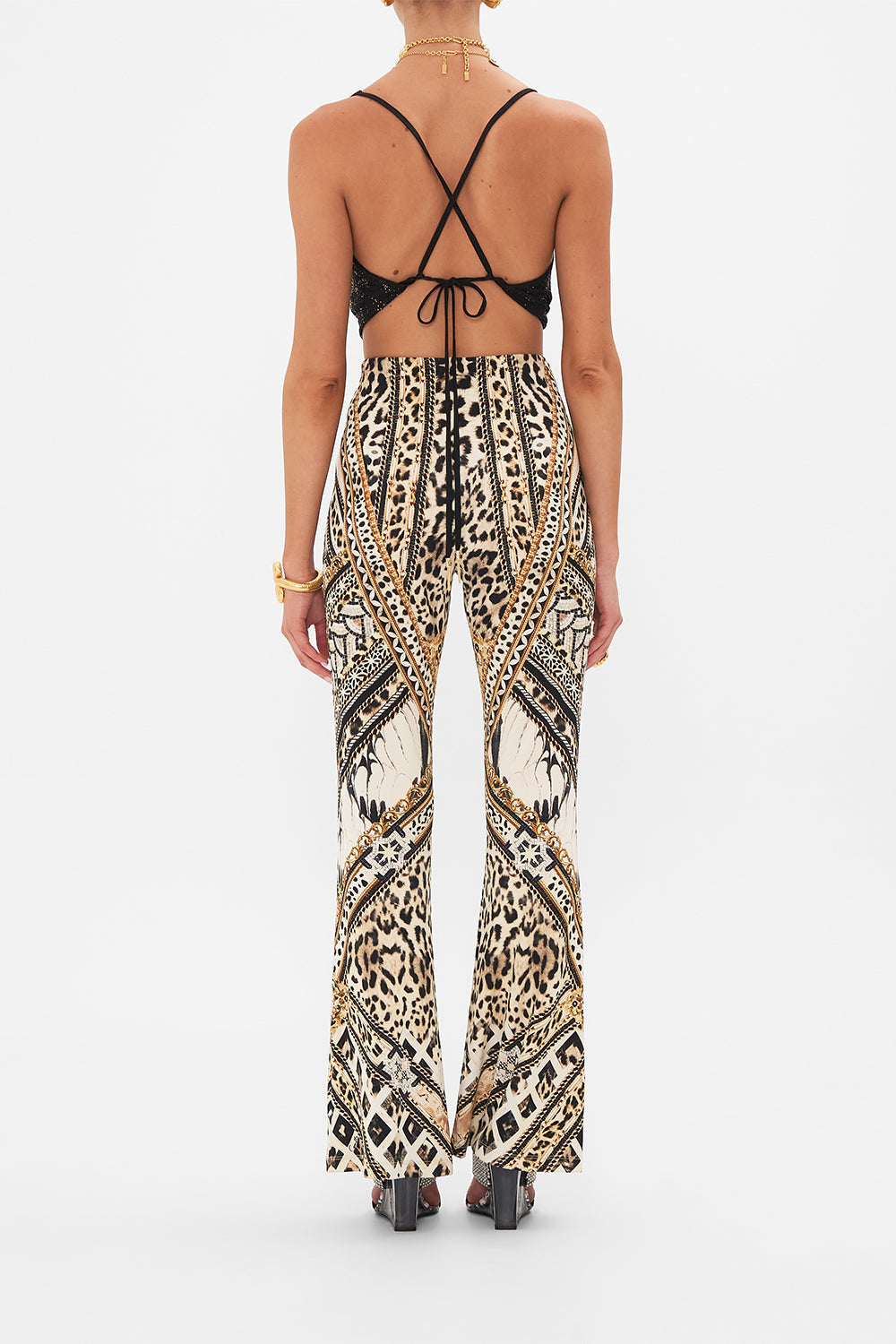 Back view of model wearing CAMILLA black halter top in Mosaic Muse