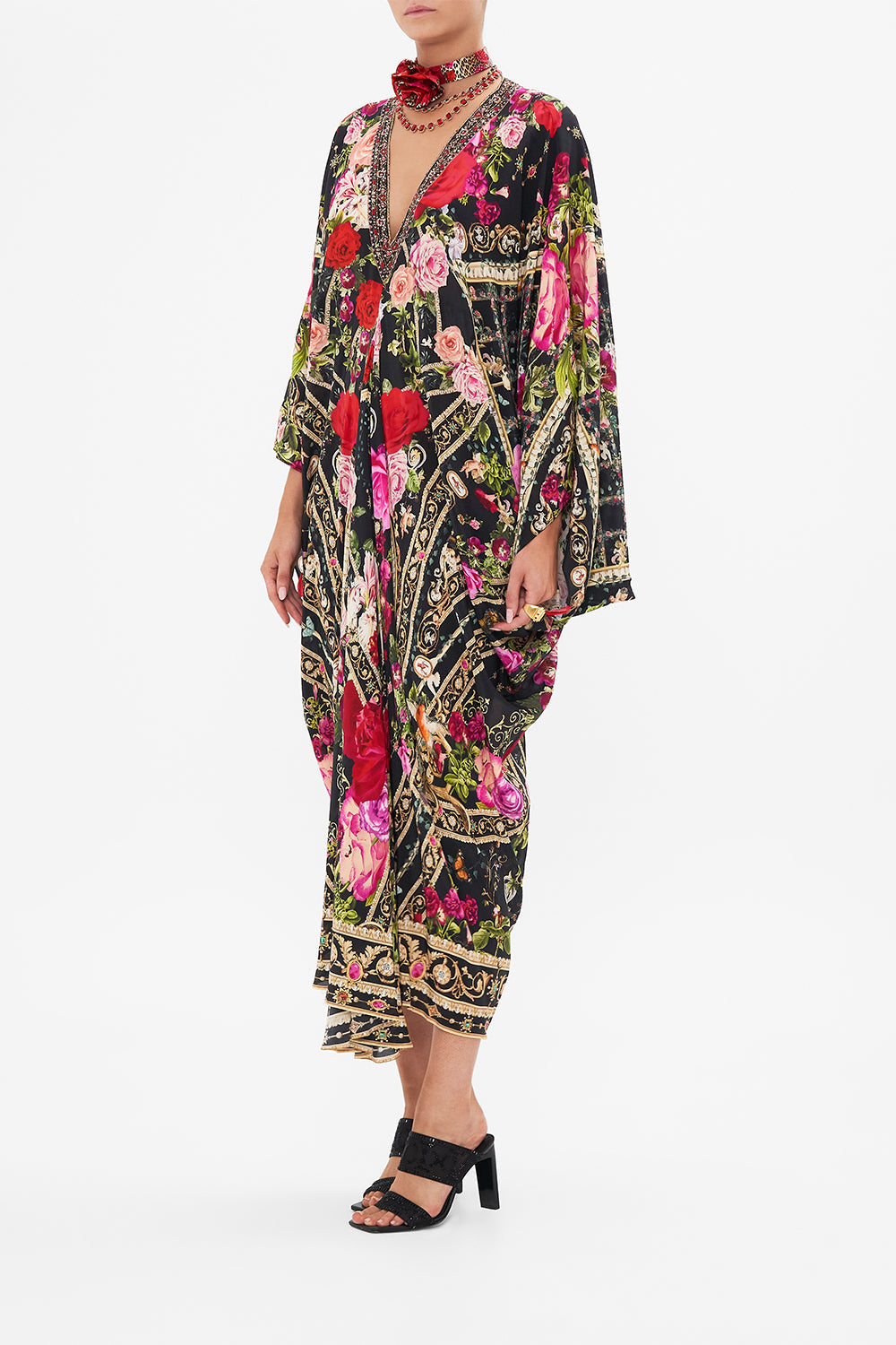 Side view of model wearing CAMILLA designer resort wear silk kaftan print in Reservation For Love print