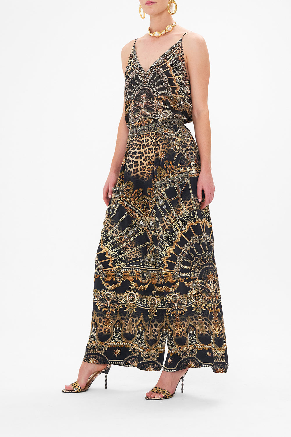 Side view of model wearing CAMILLA silk palazzo pants in Masked At Moonlight print