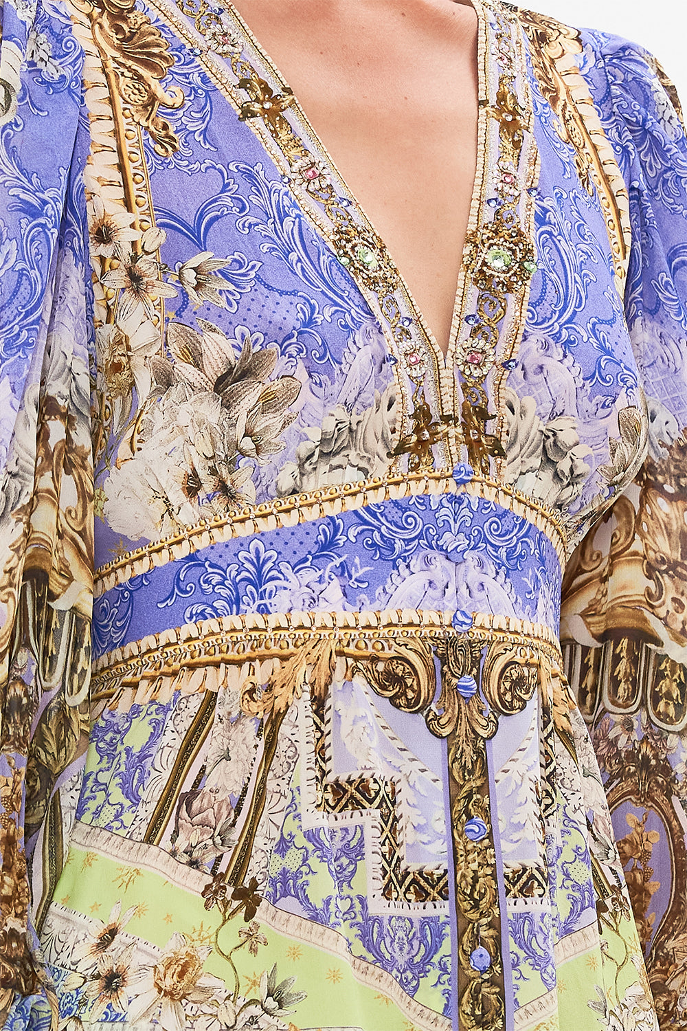 Detail view of model wearing CAMILLA silk frill drfess in Guilded Pleasures print