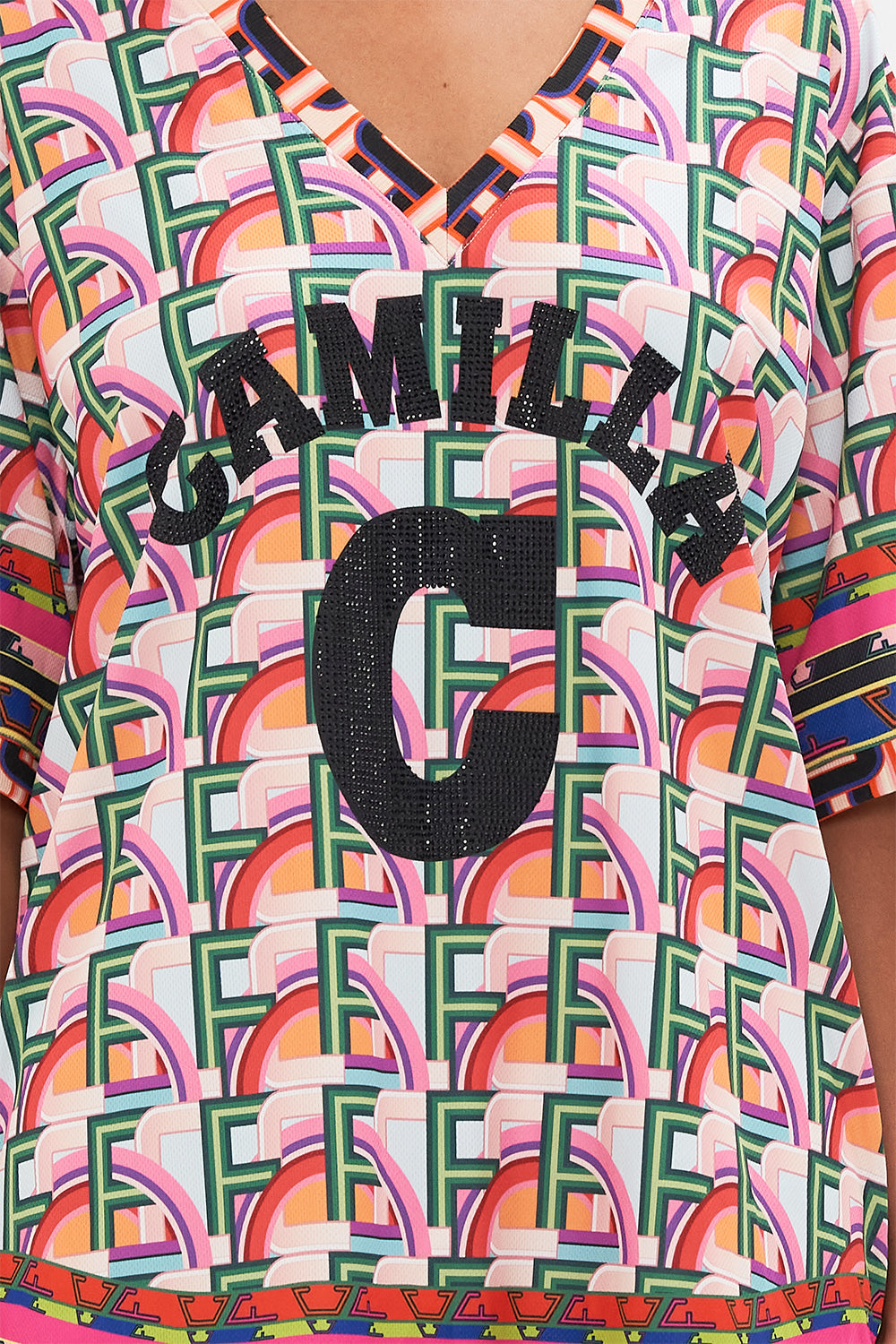 Detail view of model wearing CAMILLA activewear tee in Ciao Bella print