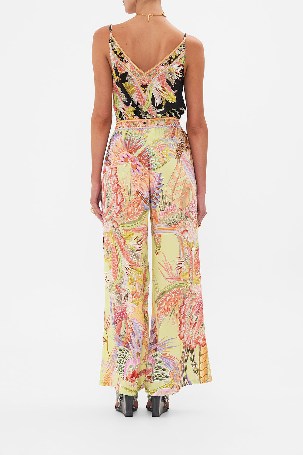 Back view of model wearing CAMILLA silk pants Cosmic Tuscan print