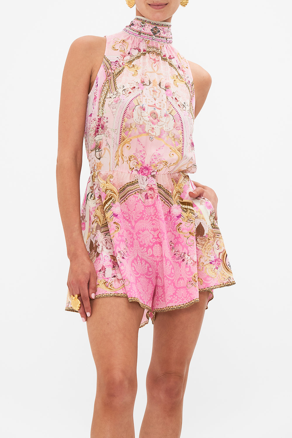 Crop view of model wearing CAMILLA silk playsuit in Fresco Fairytale print