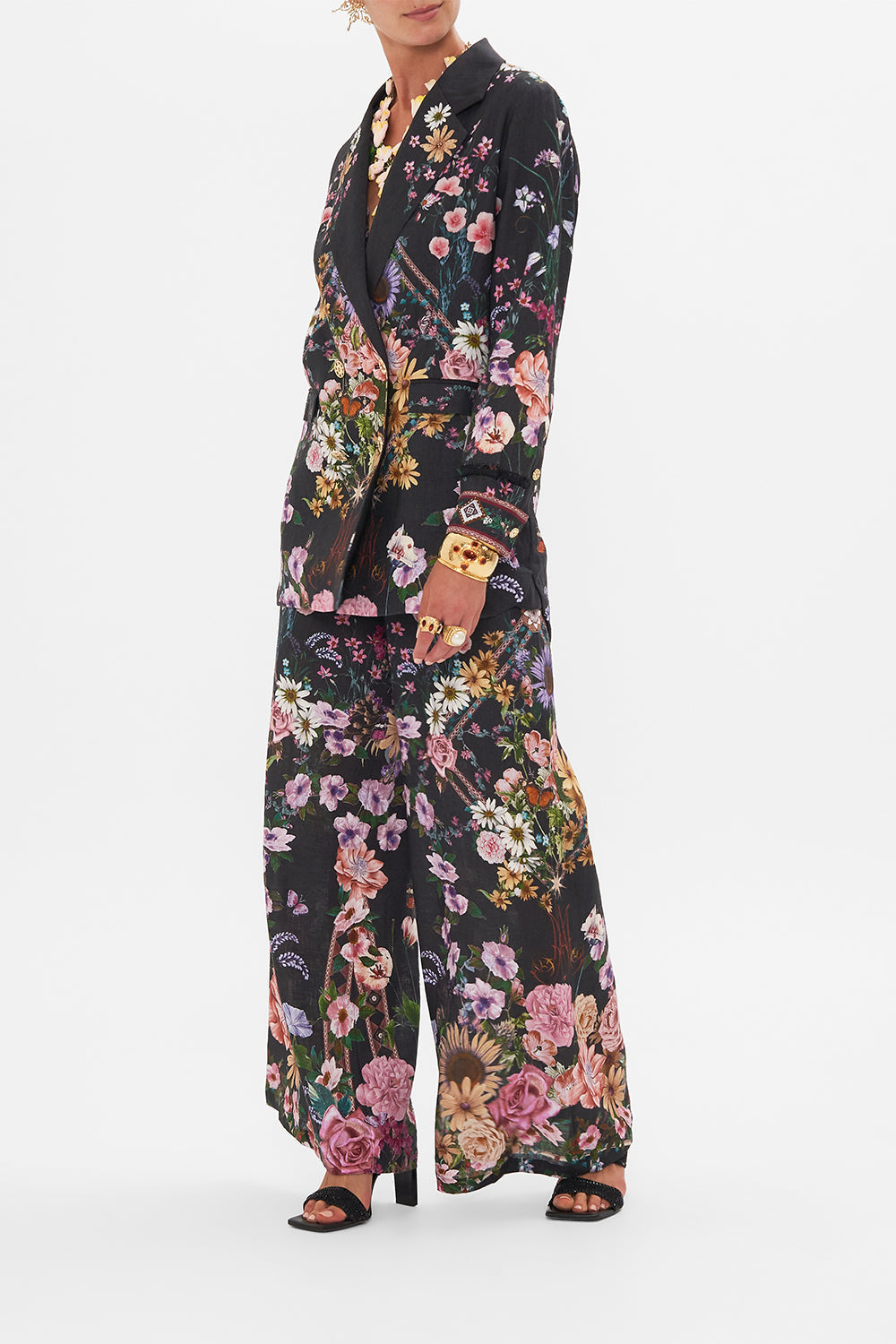 Side view of model wearing CAMILLA silk jacket in Letters From A Vineyard print