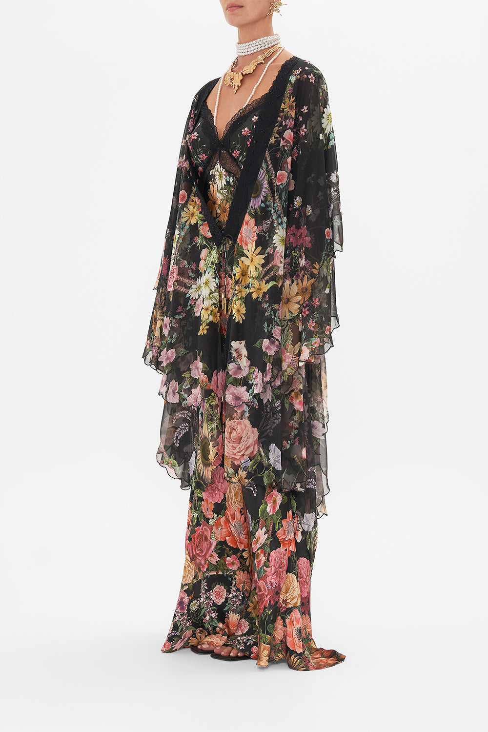 Side view of model wearing CAMILLA silk layer in Letters From A Vineyard print