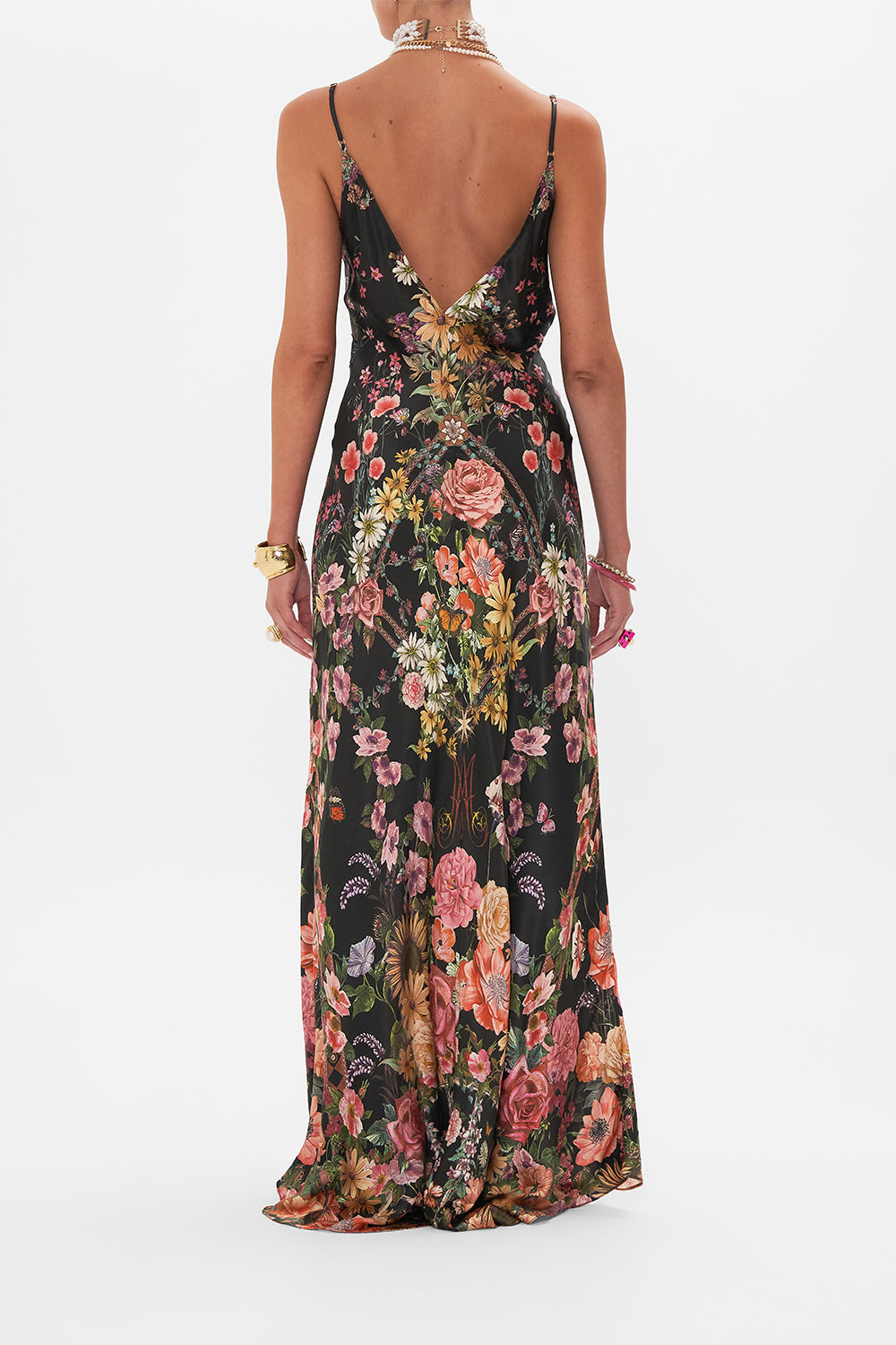 Back view of model wearing CAMILLA bias silk slip dress in Letters From A Vineyward print