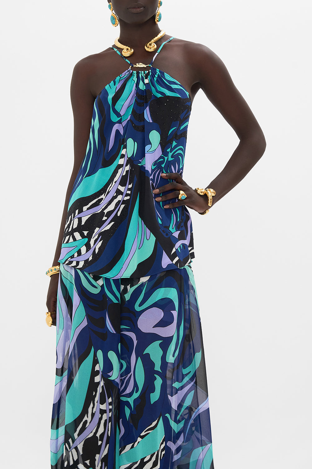 Crop view of model wearing CAMILLA silk halter top in Vividly Venice print