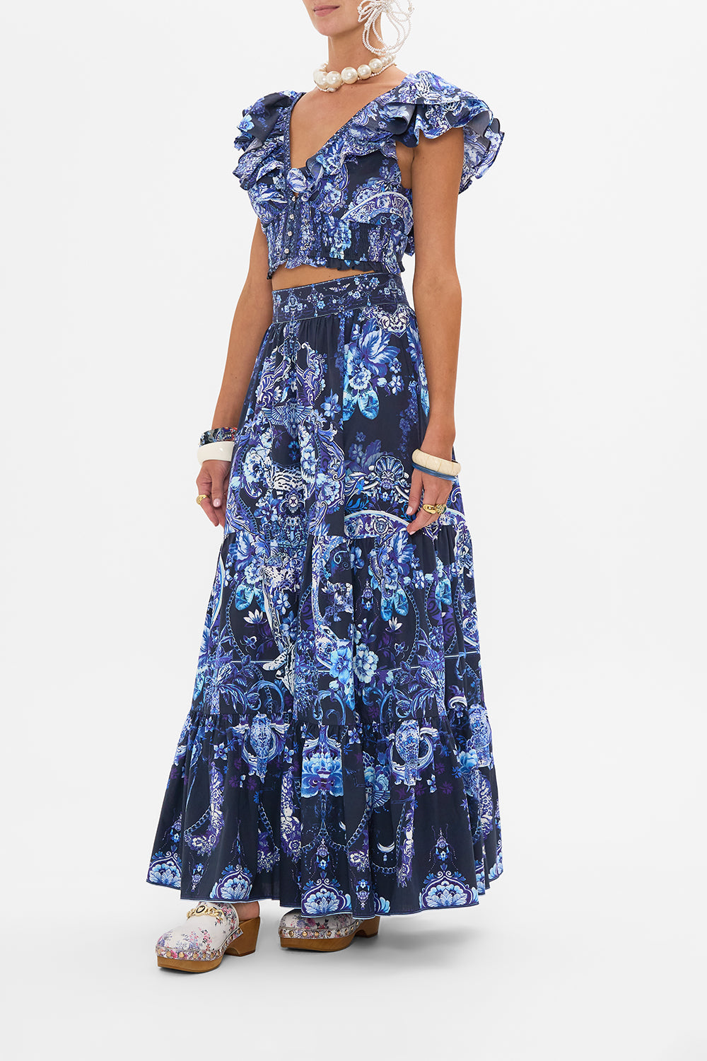 Side view of model wearing CAMILLA ruffle top in Delft Dynasty print