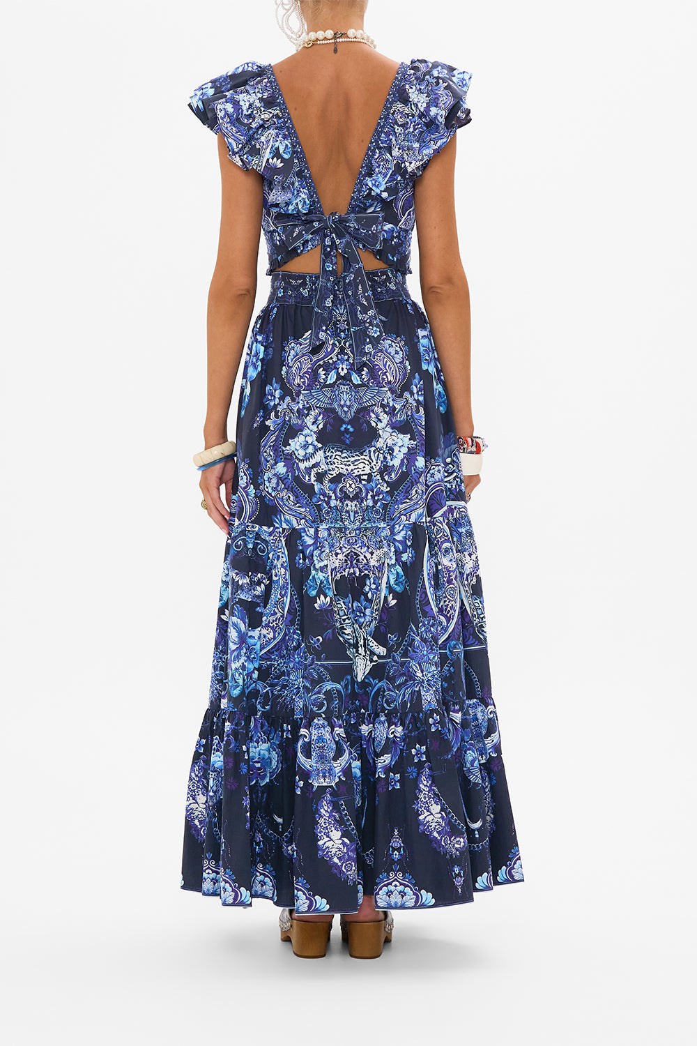 Back view of model wearing CAMILLA ruffle top in Delft Dynasty print