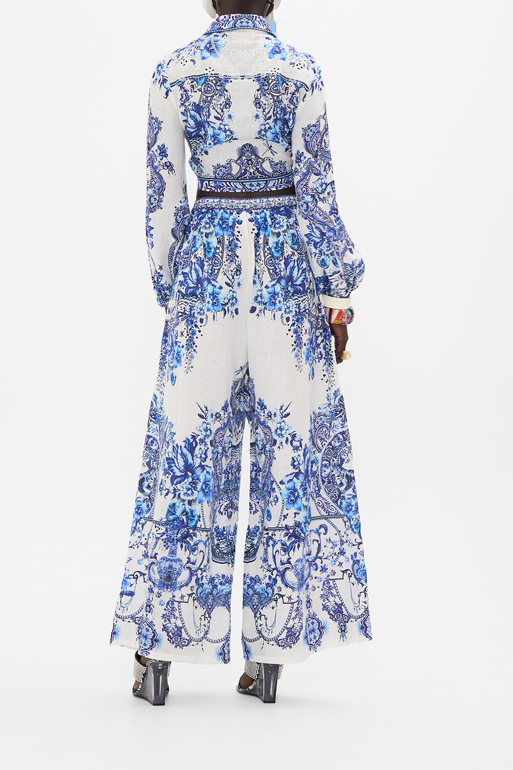 Back view of model wearing CAMILLA cropped wrap shirt in Glaze and Graze print