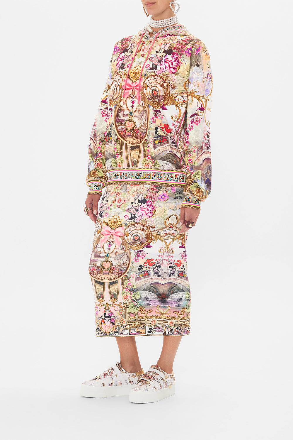 Side view of model wearing CAMILLA x Disney hoodie in Minnie Mouse Magic print