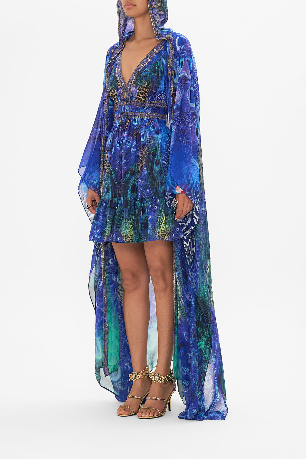Side view of model wearing CAMILLA silk robe in Peacock Rock print