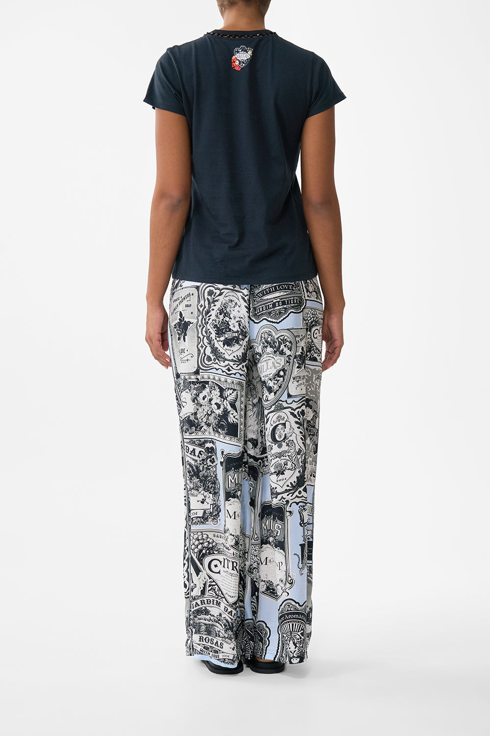 The CAMILLA Slim Fit Round Neck T-Shirt - Black in our Perfumed In Porto print.