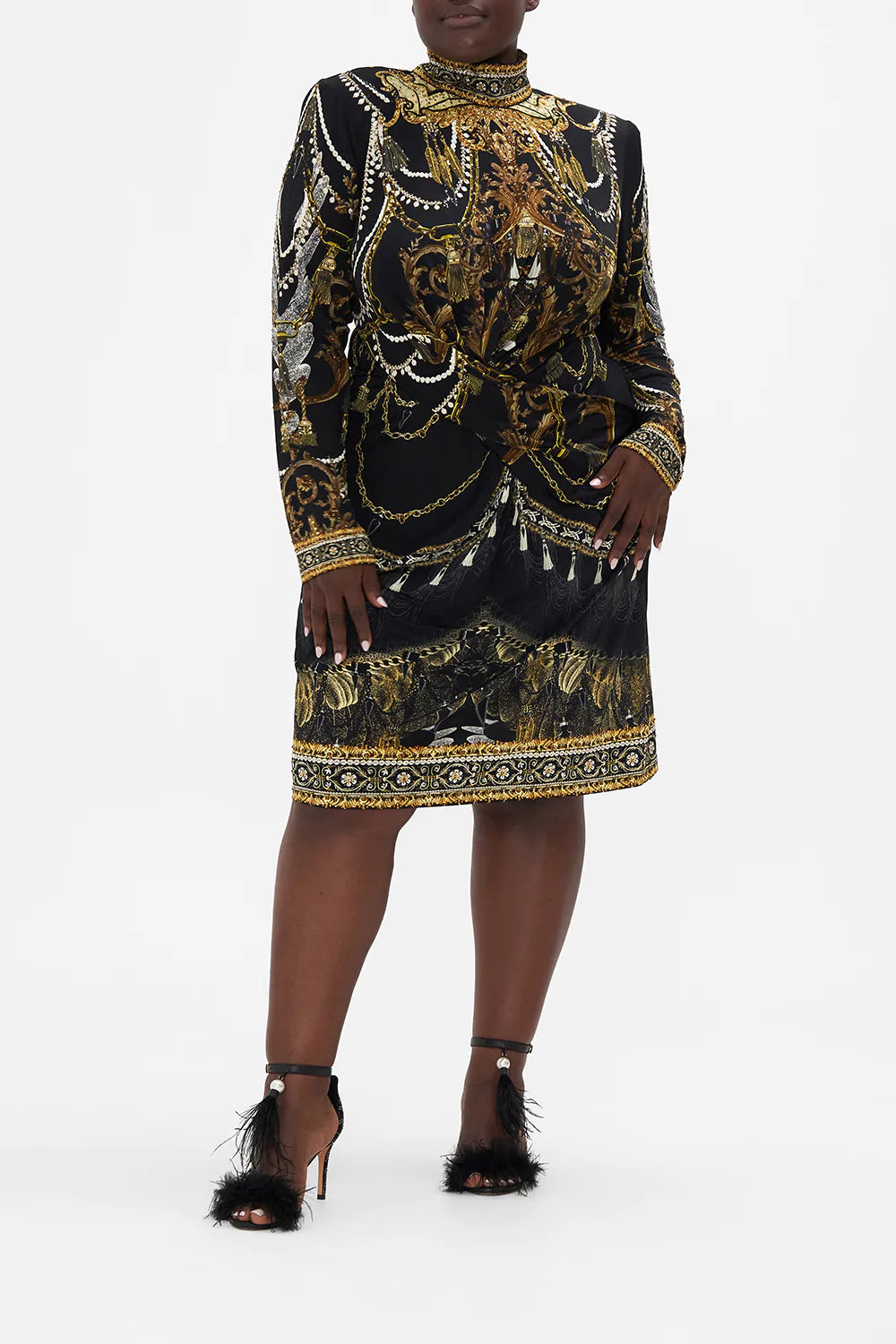 Front view of curvy model wearing CAMILLA plus size black dress in Ravin Raven print