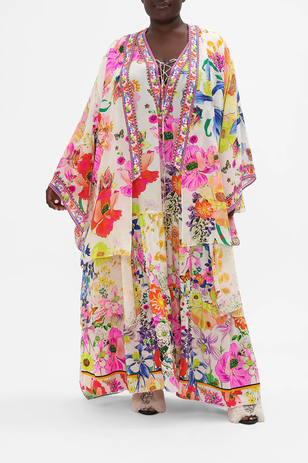 Front view of curvy model wearing CAMILLA plus size floral silk kimono in Fairy Gang print