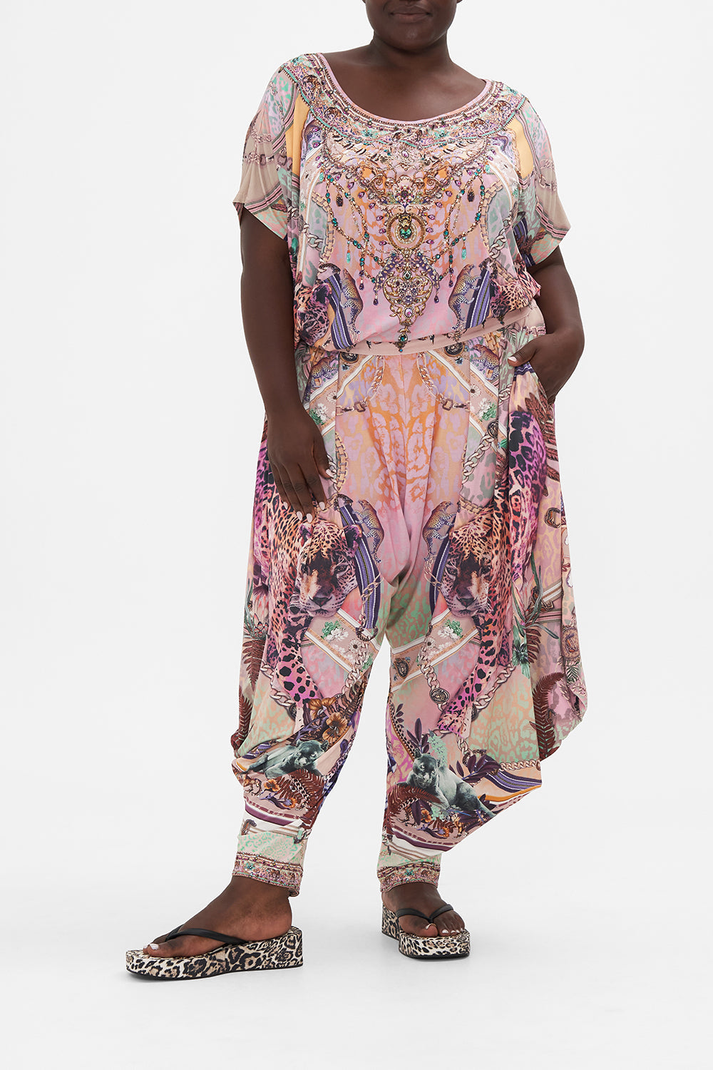 Front view of curve model wearing CAMILLA plus size drape jersey pants in Kitty Kat Klub print