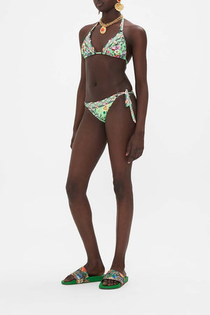 Side view of model wearing CAMILLA resort wear womens bikini in Porcelain Dream print