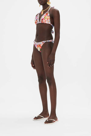 Side view of model wearing CAMILLA resort wear womens bikini in Dutch Is Life print