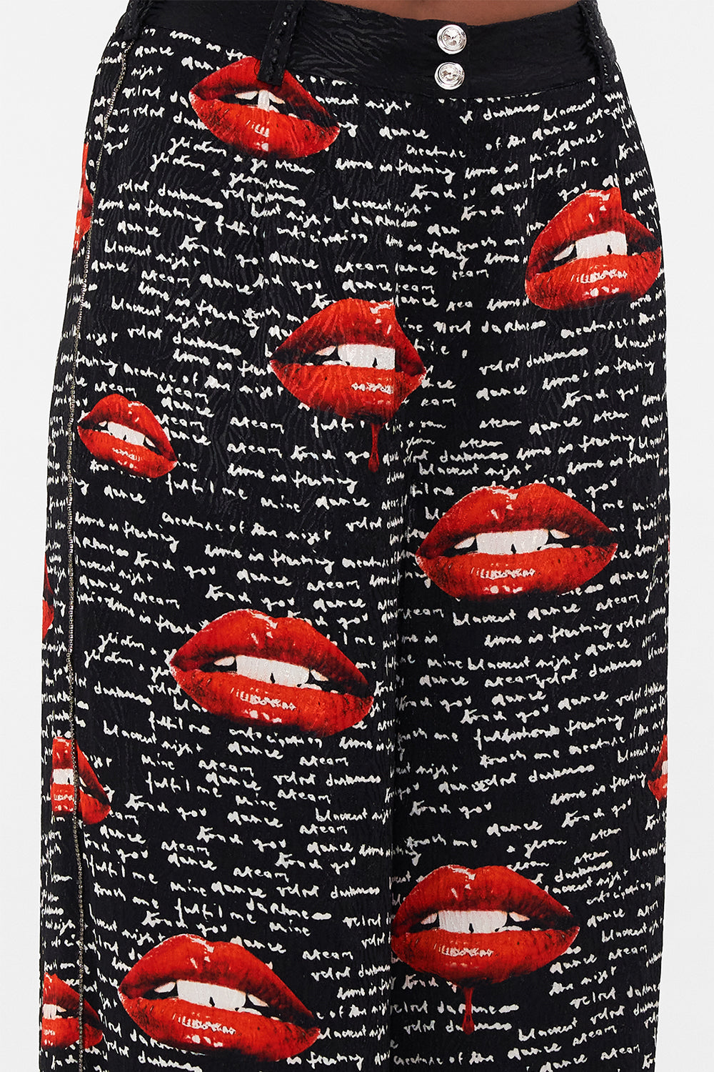 Detail view of model wearing CAMILLA palazzo pants in black Chaos Magic  print