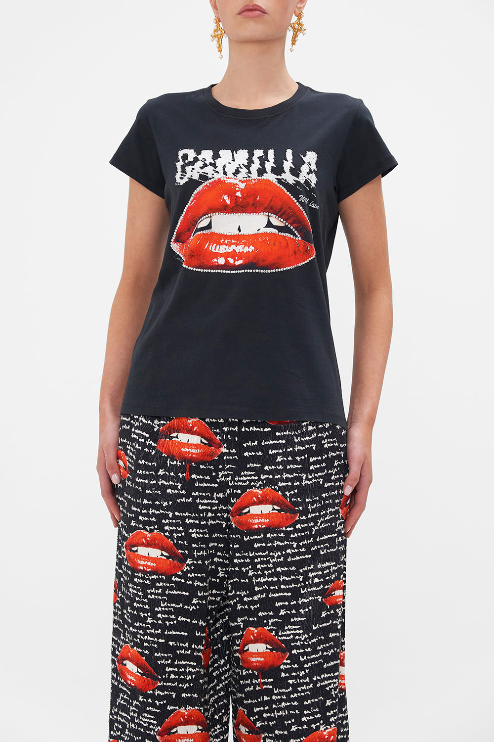 Crop view of model wearing CAMILLA black graphic tee in Chaos Magic print 