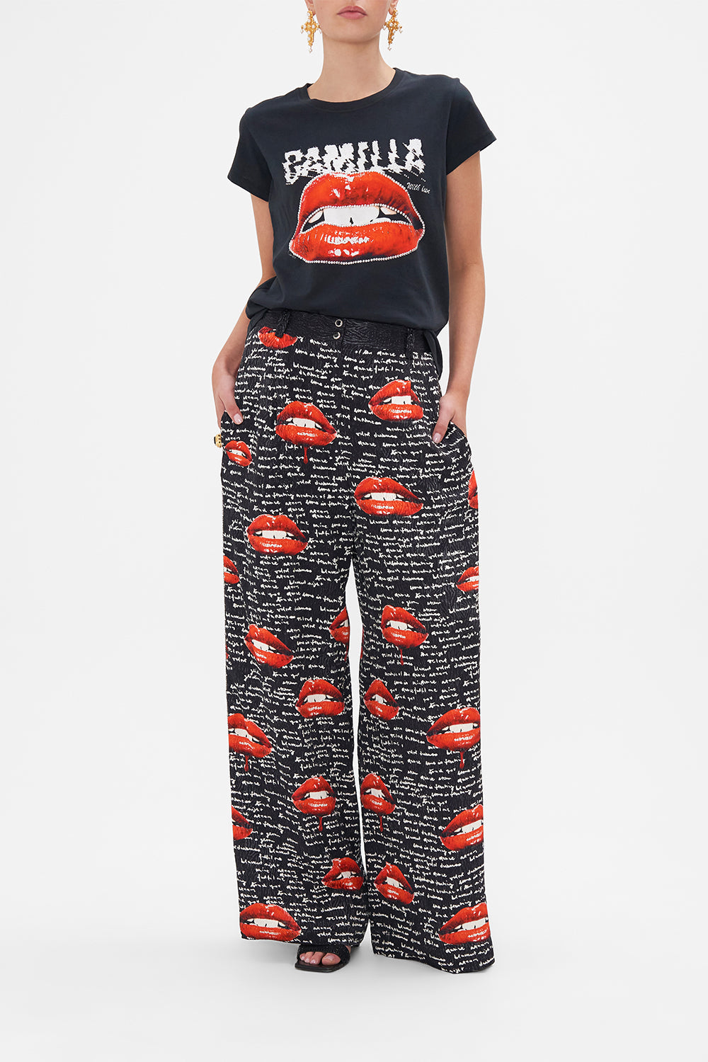 Front view of model wearing CAMILLA black graphic tee in Chaos Magic print 