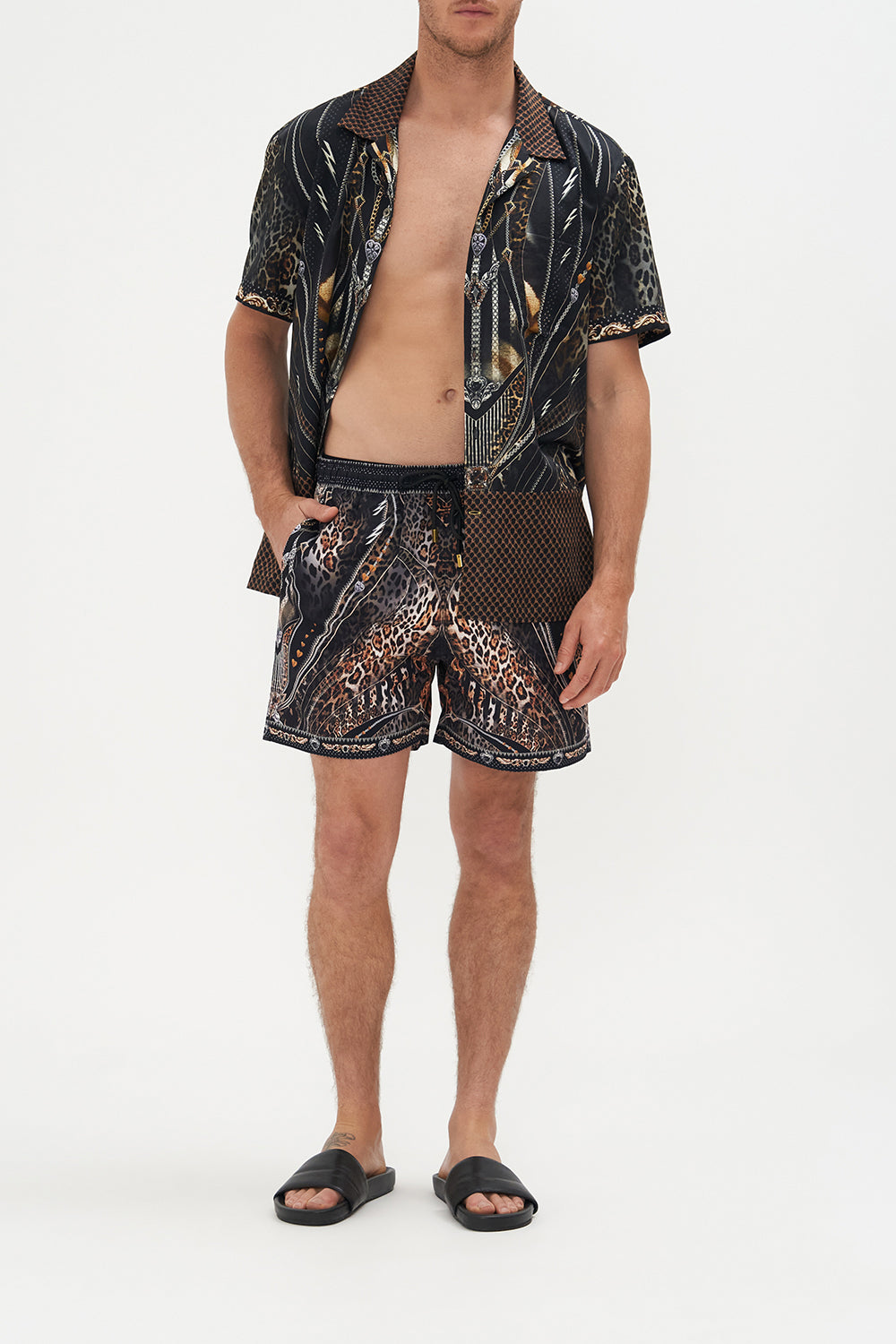 Front view of model wearing Hotel Franks by CAMILLA mens elastic waist boardshorts in Chaos In The Cosmos  animal print 