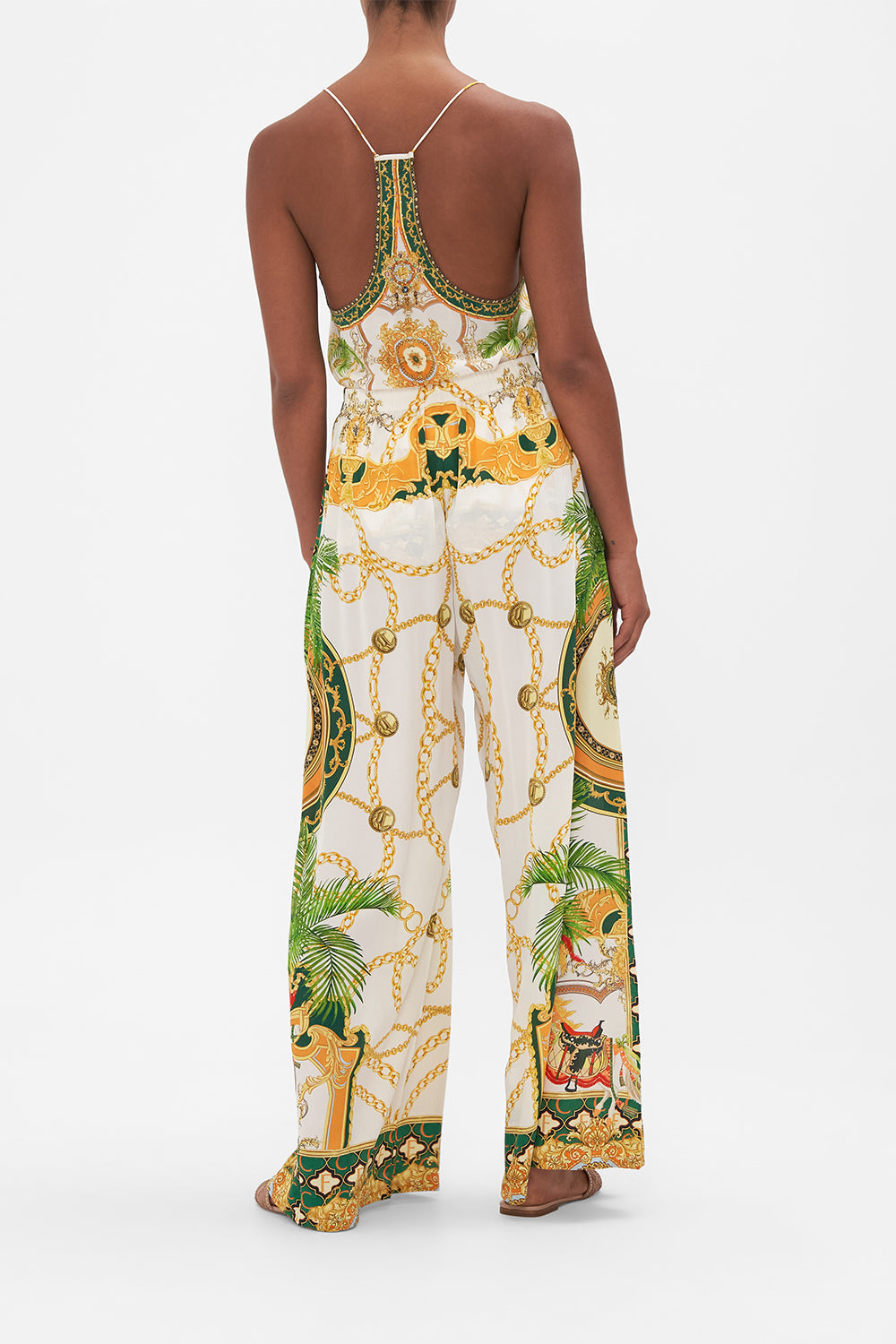 Back view of model wearing CAMILLA silk pants in My Sweet Devotion print 