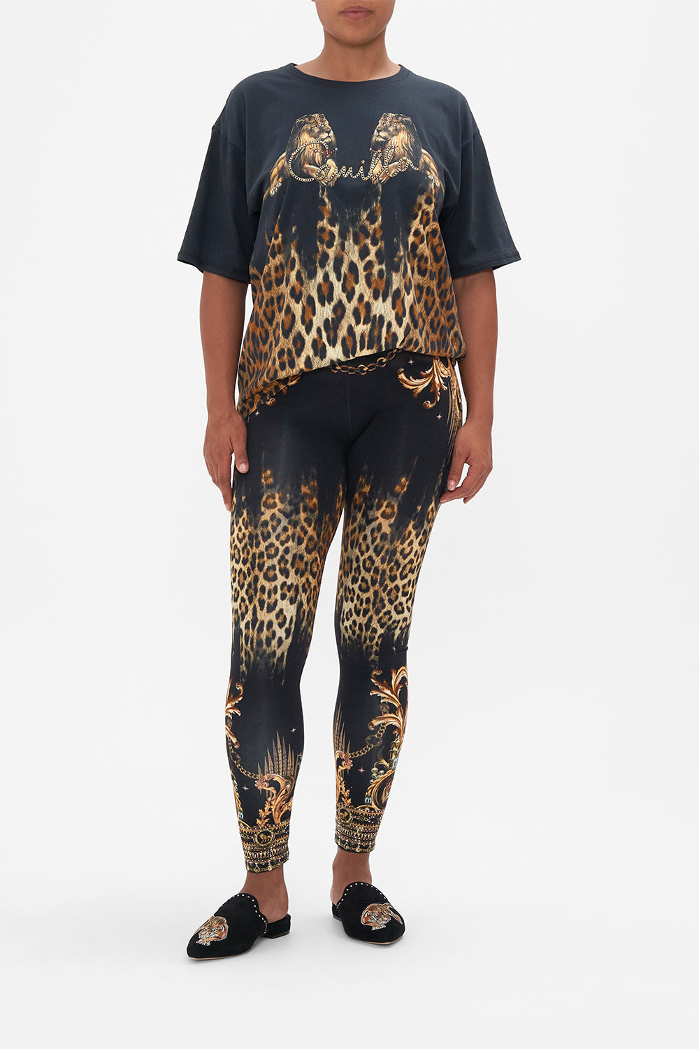 Front view of model wearing CAMILLA leggings in Sing My Song print