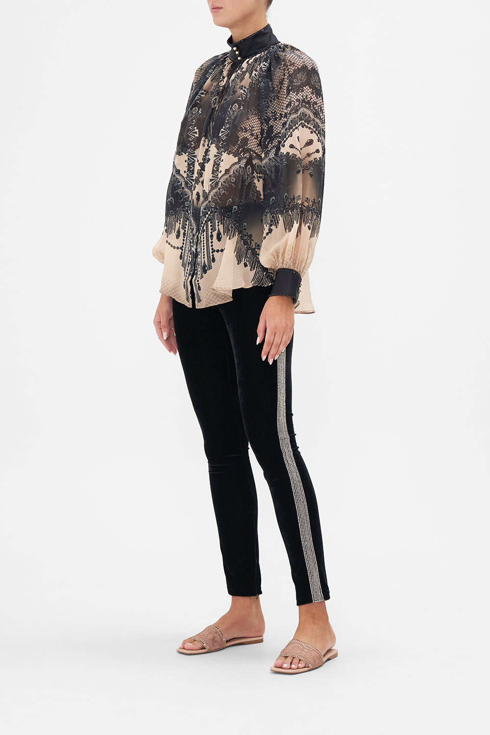 Side view of model wearing CAMILLA black velvet pants in Curtain Call Chaos