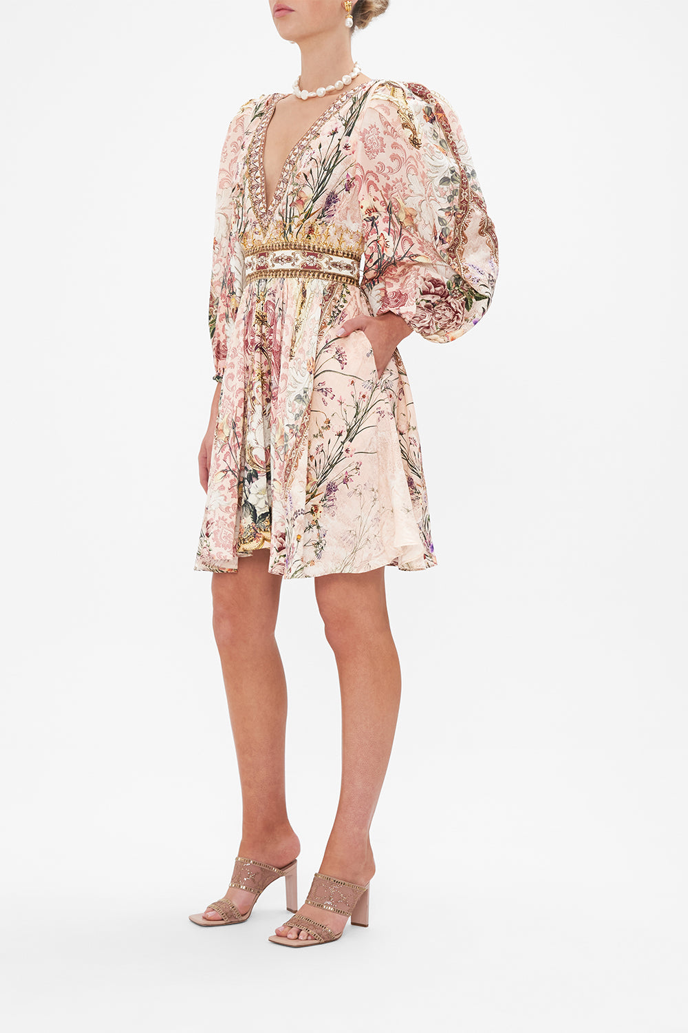 Side view of model wearing CAMILLA floral mini dress in Kissed By The Prince print