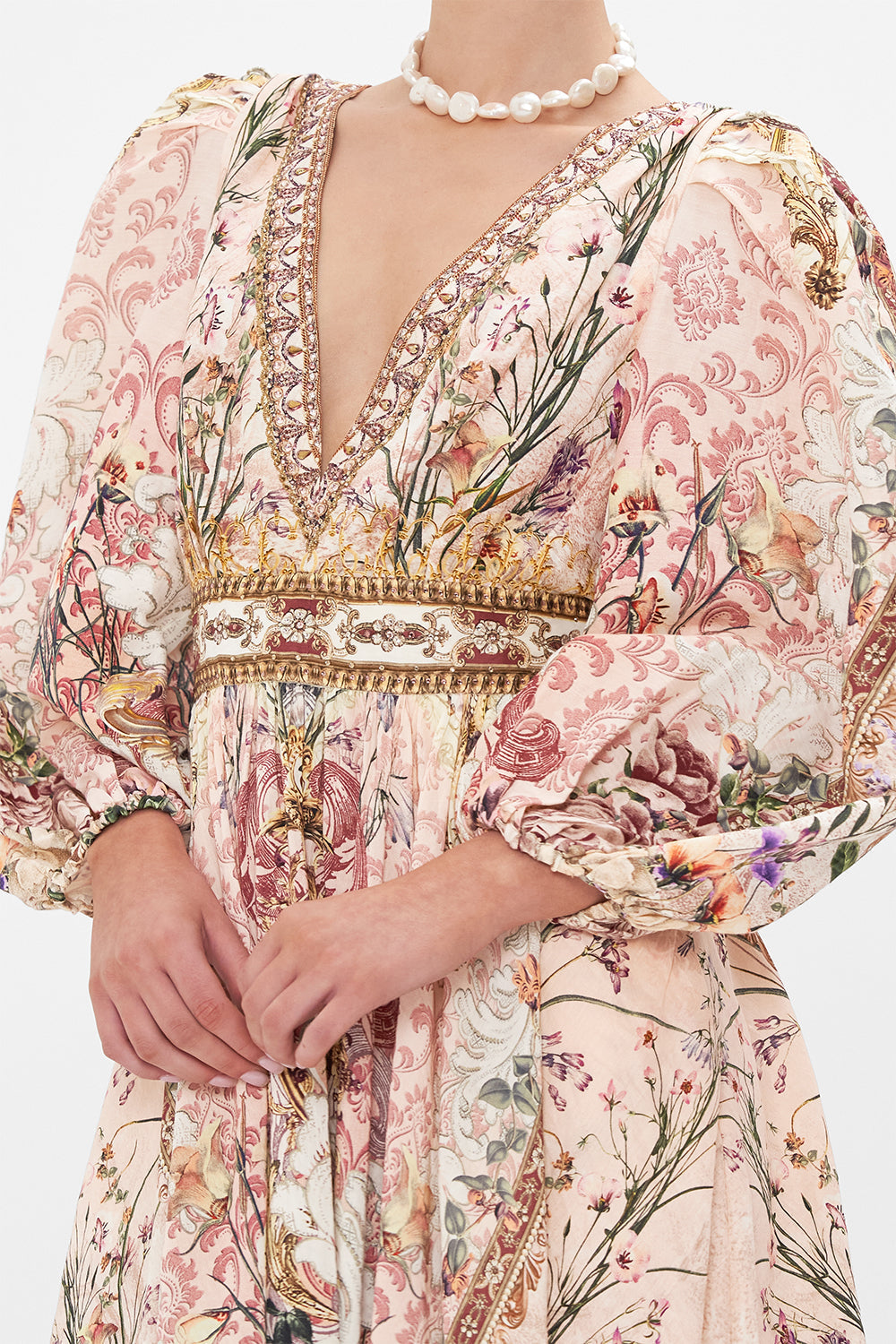 Detail view of model wearing CAMILLA floral mini dress in Kissed By The Prince print