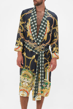 Crop view of model wearing Hotel Franks by CAMILLA mens silk robe in Jealousy And Jewels print