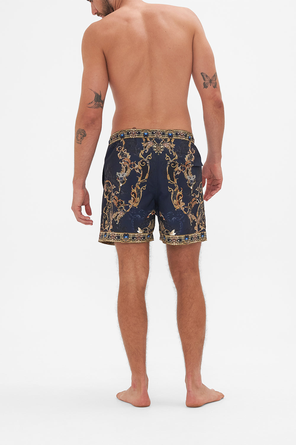 Back view of model wearing Hotel Franks by CAMILLA mens navy boardshorts in Moonlight Melodies print