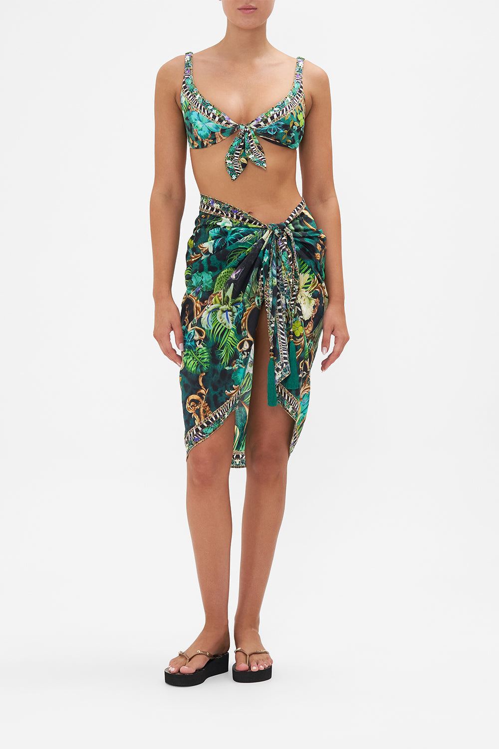 Front view of model wearing CAMILLA resort wear sarong in Sing My Song print