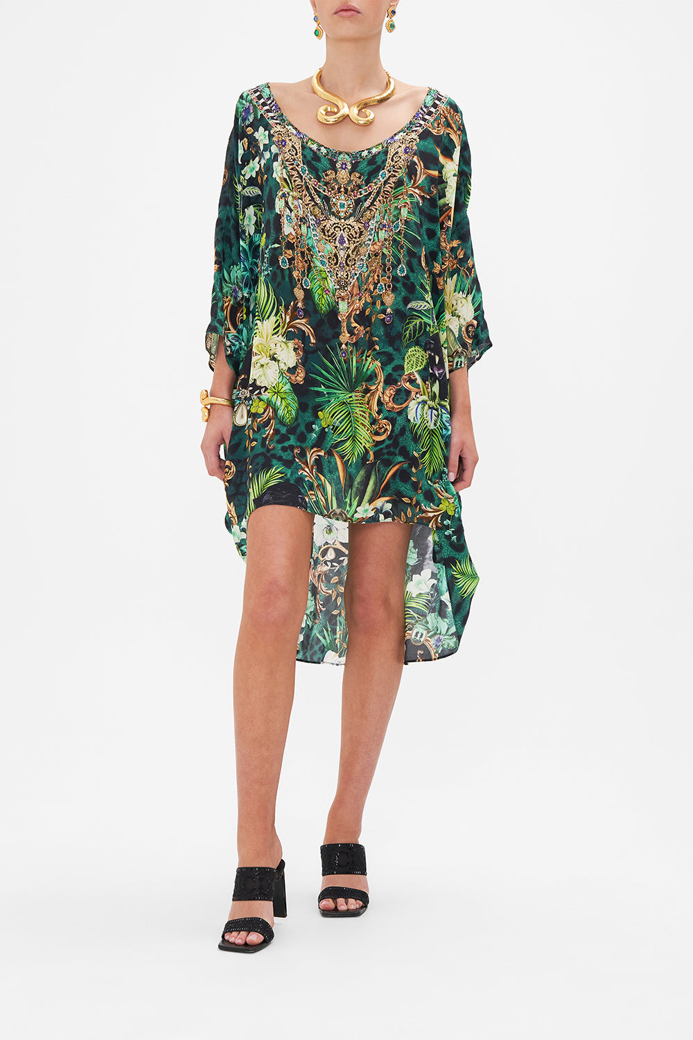 Front view of model wearing CAMILLA green tropical print dress in Sing My Song print