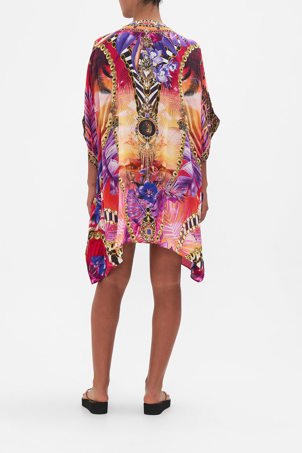 Back view of model wearing CAMILLA resortwear silk kaftan in Wild Loving print 