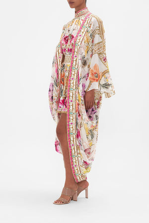 Side view of model wearing CAMILLA silk floral kimono in Destiny Calling print