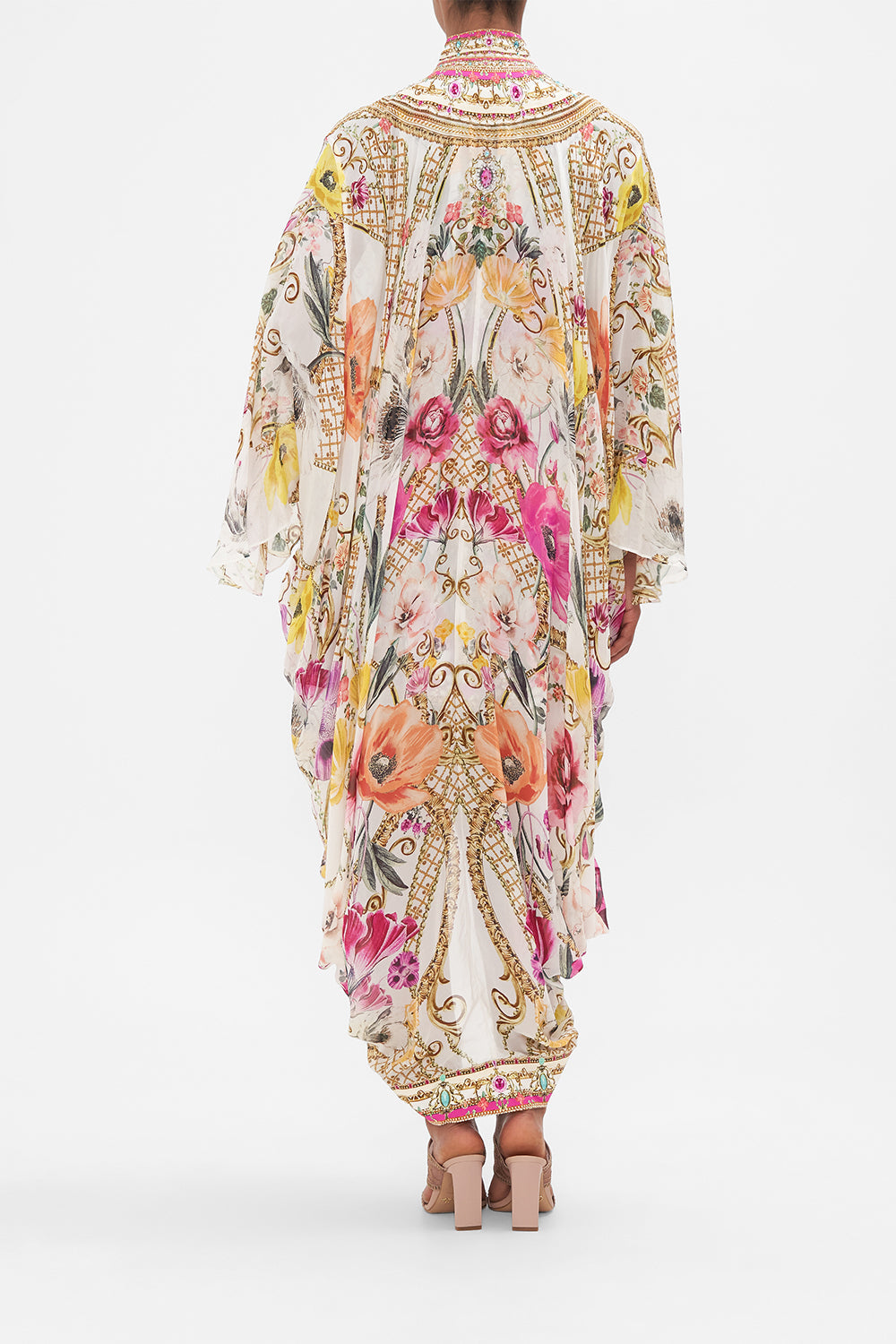 Back view of model wearing CAMILLA silk floral kimono in Destiny Calling print