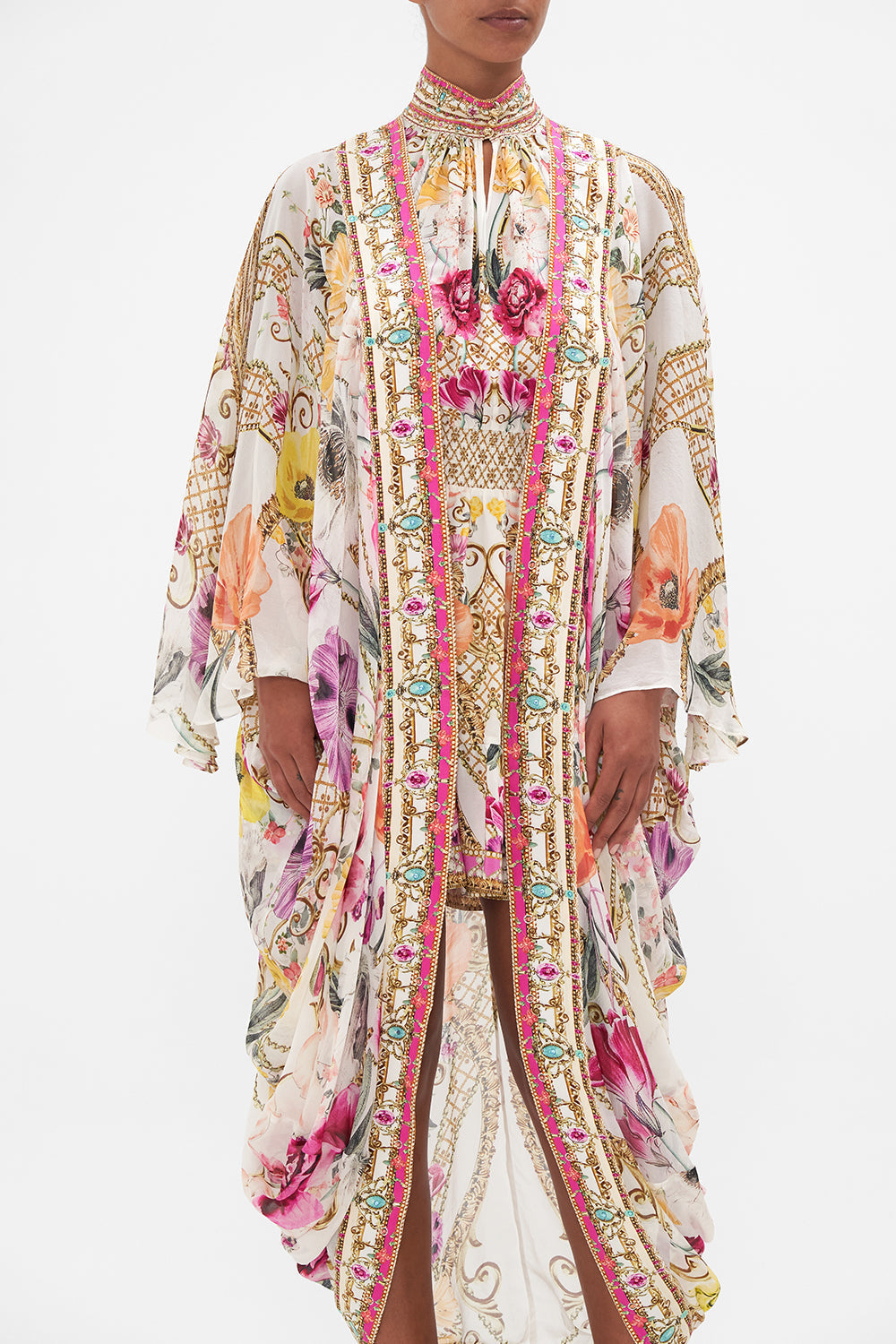 Crop view of model wearing CAMILLA silk floral kimono in Destiny Calling print