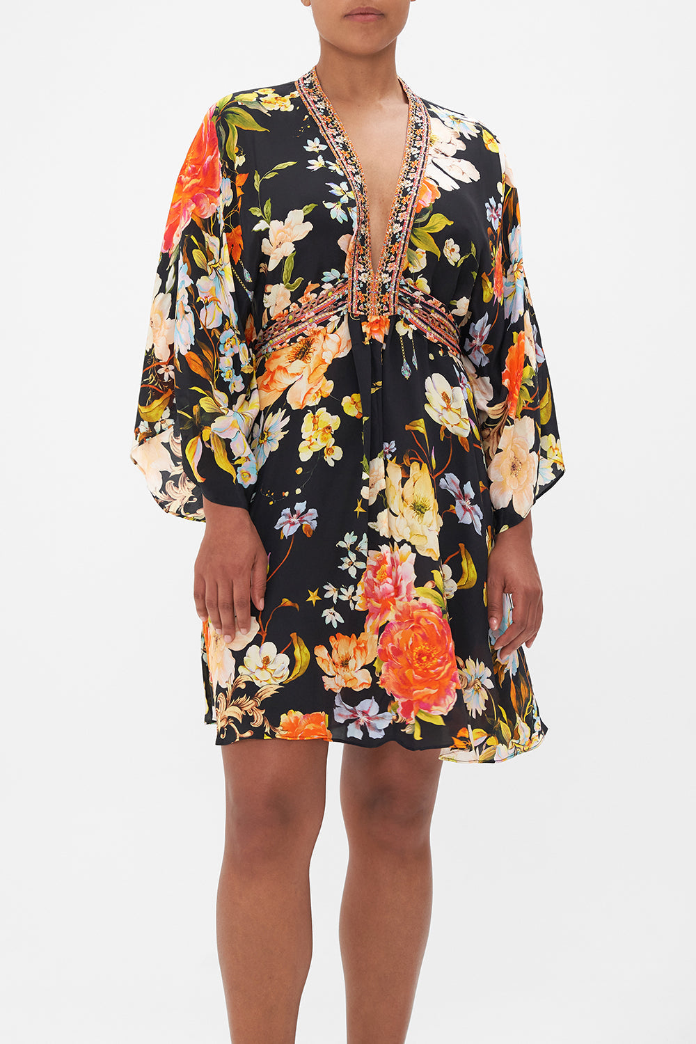 Crop view of model wearing CAMILLA floral silk kaftan in Secret History print