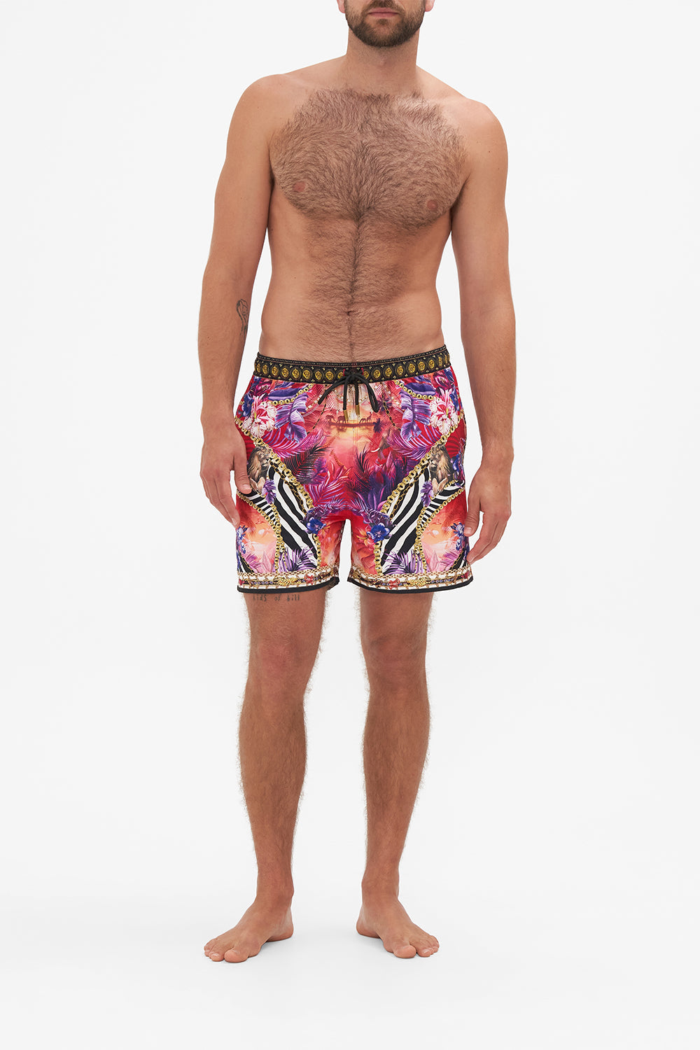 Front view of model wearing Hotel Franks by CAMILLA mens tropical print boardshorts in Wild Loving print