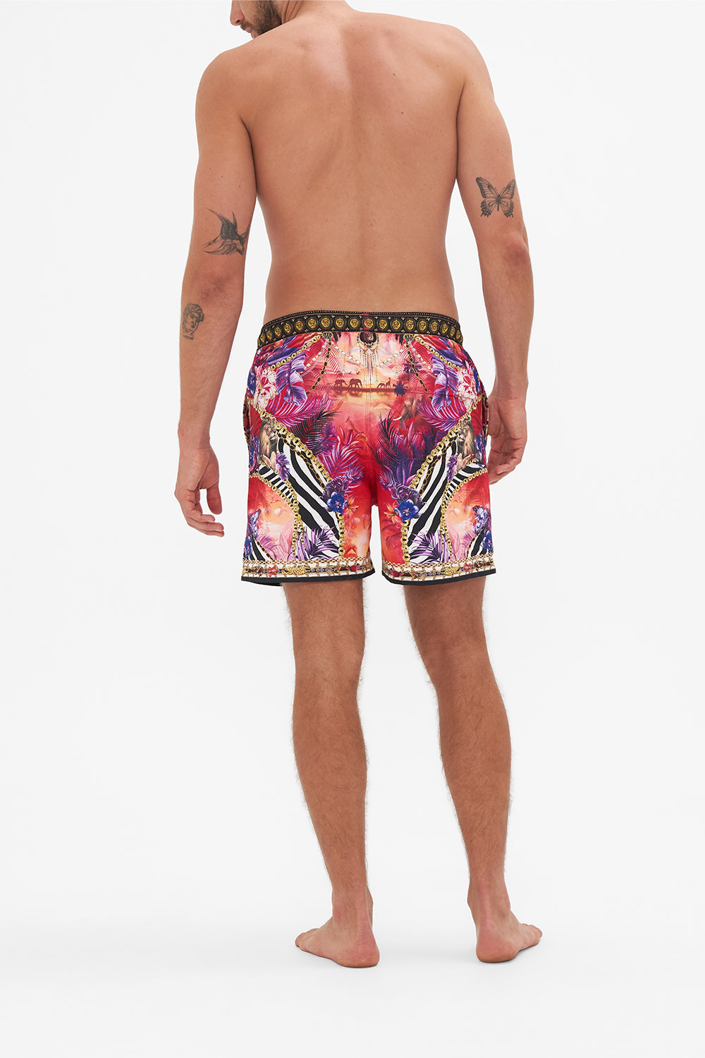 Back view of model wearing Hotel Franks by CAMILLA mens tropical print boardshorts in Wild Loving print