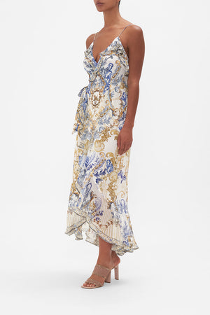 Side view of model wearing CAMILLA silk wrap dress in Soul Searching  print